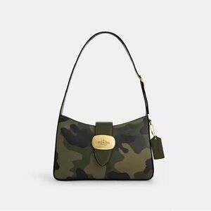Brand new with tags and sold out on Coach outlet. Eliza shoulder purse.